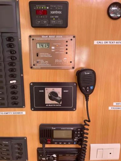 Endless Summer Yacht Photos Pics Control panel with Xantrex charger, Blue Sky solar controller, and Icom radio in Admiral Executive 2008.