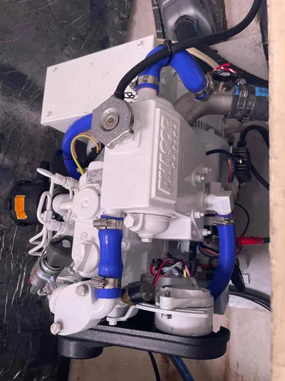 Endless Summer Yacht Photos Pics Engine compartment of a 2008 Admiral Executive with blue hoses and mechanical components.