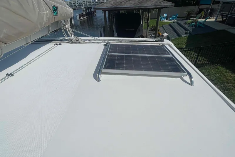 Endless Summer Yacht Photos Pics Rooftop solar panel on 2008 Admiral Executive boat near waterfront.