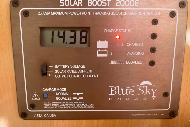 Endless Summer Yacht Photos Pics Blue Sky Energy solar charge controller displaying 14.38 volts, model Solar Boost 2000E.