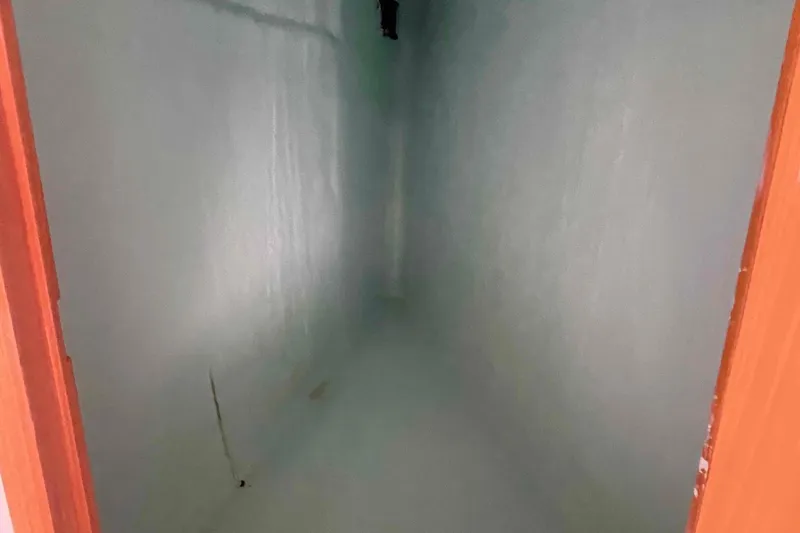 Endless Summer Yacht Photos Pics Narrow, empty room with light blue walls and wooden door frame. Admiral Executive 2008.