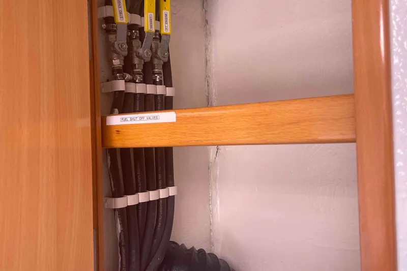 Endless Summer Yacht Photos Pics Fuel shut-off valves in a 2008 Admiral Executive, secured with clamps and labeled.