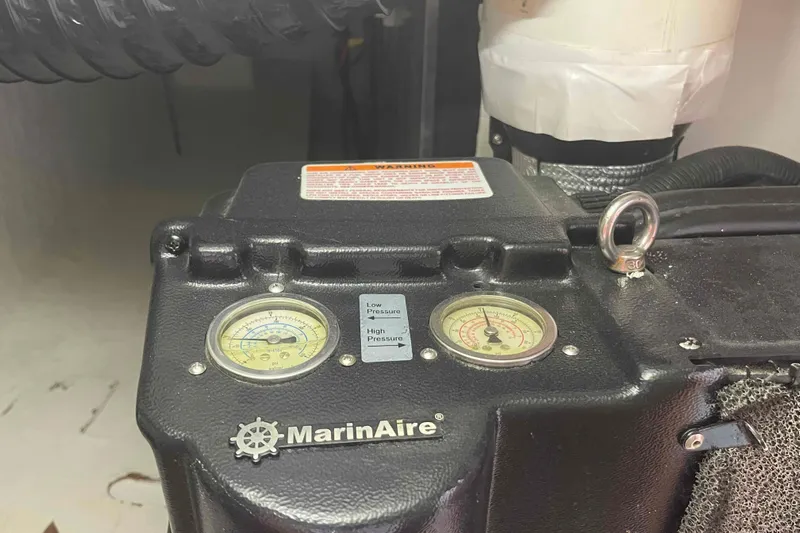 Endless Summer Yacht Photos Pics MarinAire unit with pressure gauges, Admiral Executive 2008 model, in a mechanical setting.
