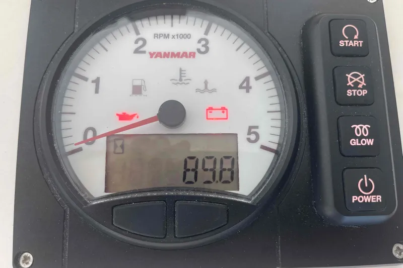 Endless Summer Yacht Photos Pics Tachometer with control buttons on a 2008 Admiral Executive boat dashboard.