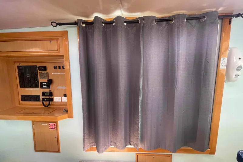 Endless Summer Yacht Photos Pics Control panel and gray curtains inside a 2008 Admiral Executive vehicle.