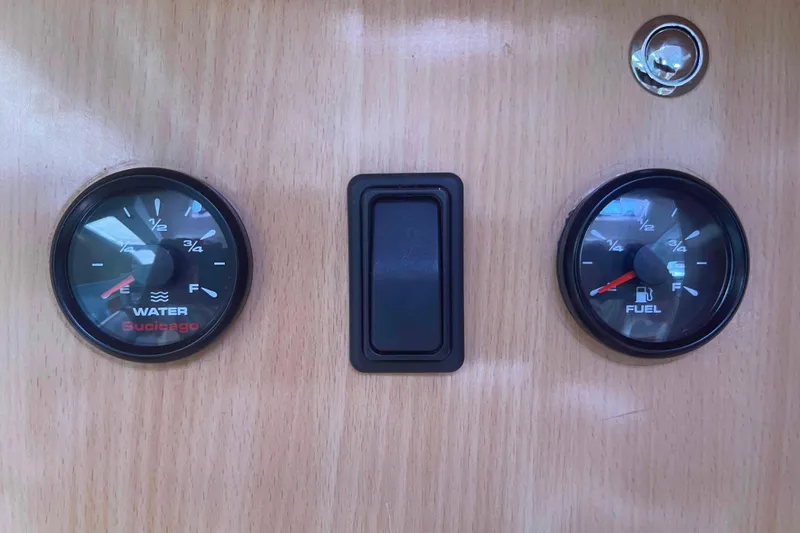 Endless Summer Yacht Photos Pics Dashboard gauges of a 2008 Admiral Executive, showing water and fuel levels.