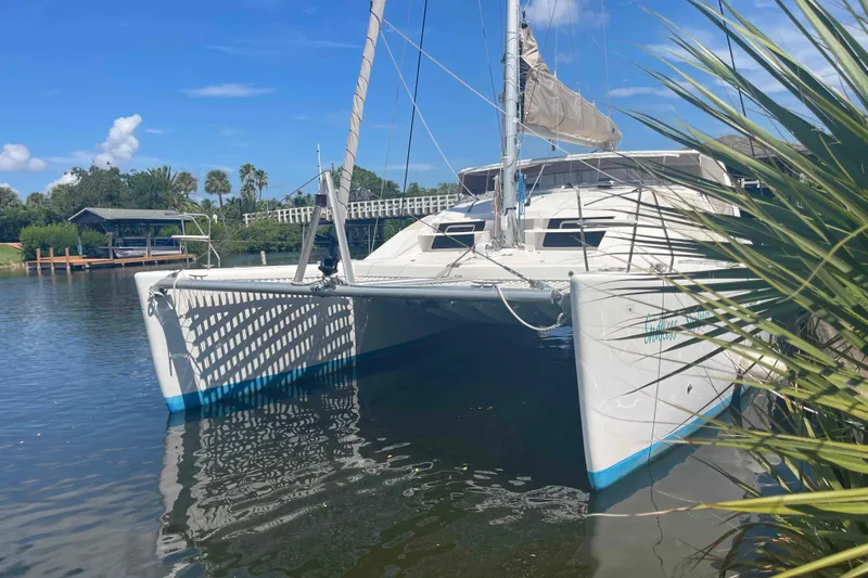 Endless Summer Yacht Photos Pics 2008 Admiral Executive catamaran docked in a serene marina setting.