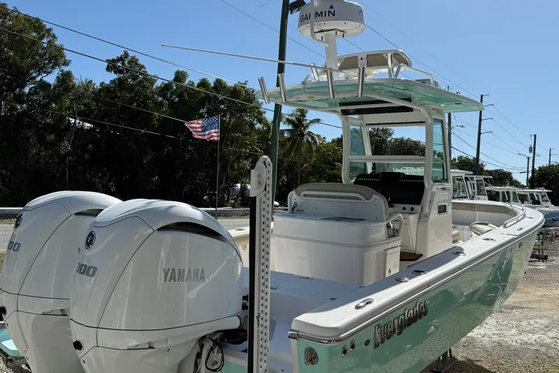 Stunning Seafoam Green Yacht Photos Pics 2022 Everglades 273 Center Console boat with twin Yamaha 300 engines, docked outdoors.