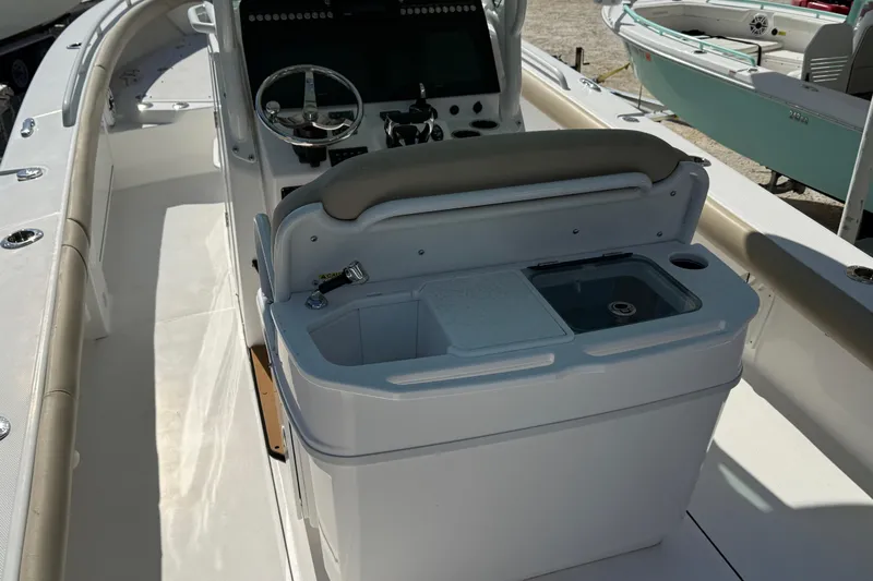 Stunning Seafoam Green Yacht Photos Pics 2022 Everglades 273 Center Console boat interior with helm and seating area.