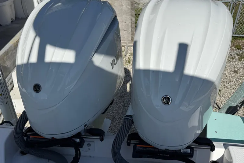 Stunning Seafoam Green Yacht Photos Pics Twin Yamaha outboard engines on a 2022 Everglades 273 Center Console boat.