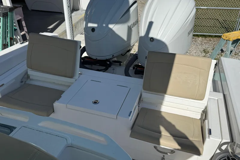 Stunning Seafoam Green Yacht Photos Pics 2022 Everglades 273 Center Console boat with dual Yamaha engines and beige seating.