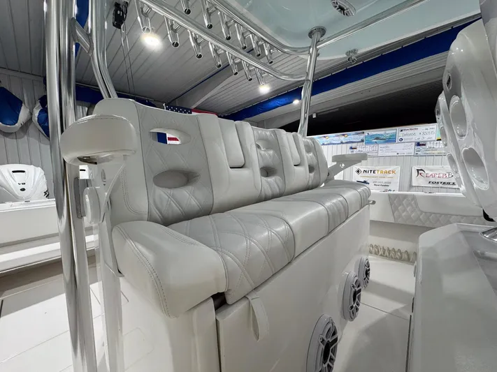  Yacht Photos Pics 2024 Contender 44 ST boat interior with luxurious seating and modern design.