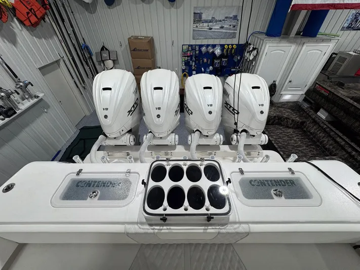  Yacht Photos Pics 2024 Contender 44 ST boat with four powerful V8 engines in a well-equipped garage.