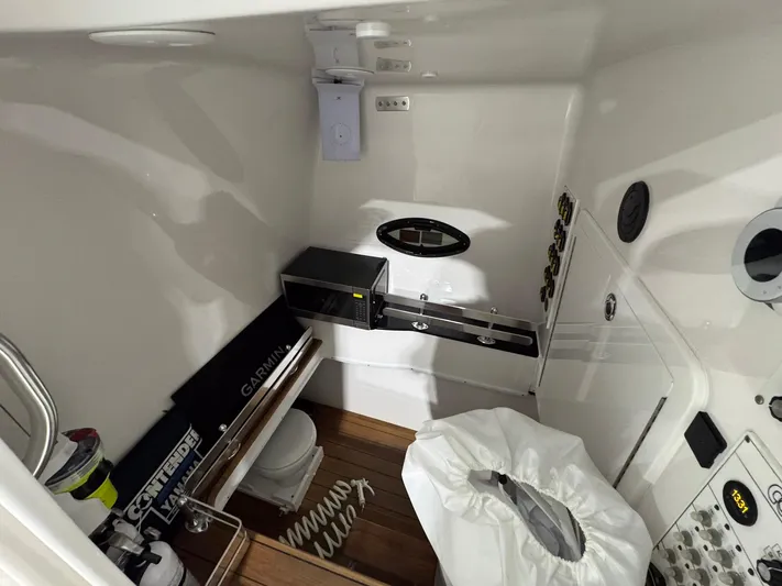  Yacht Photos Pics 2024 Contender 44 ST boat interior with modern amenities and wooden flooring.