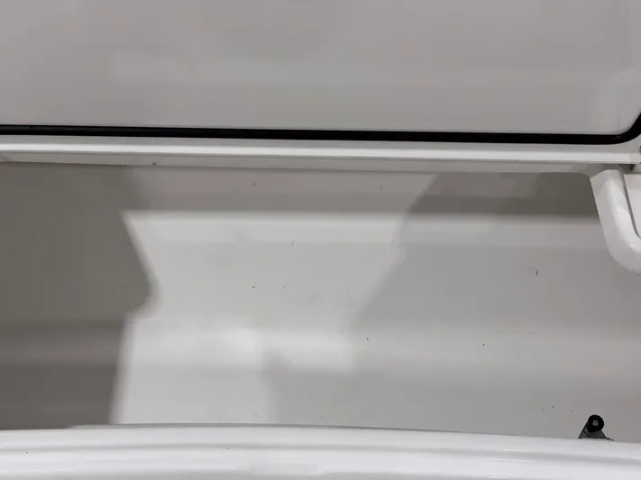  Yacht Photos Pics Open storage compartment of 2024 Contender 44 ST boat, showcasing interior space.