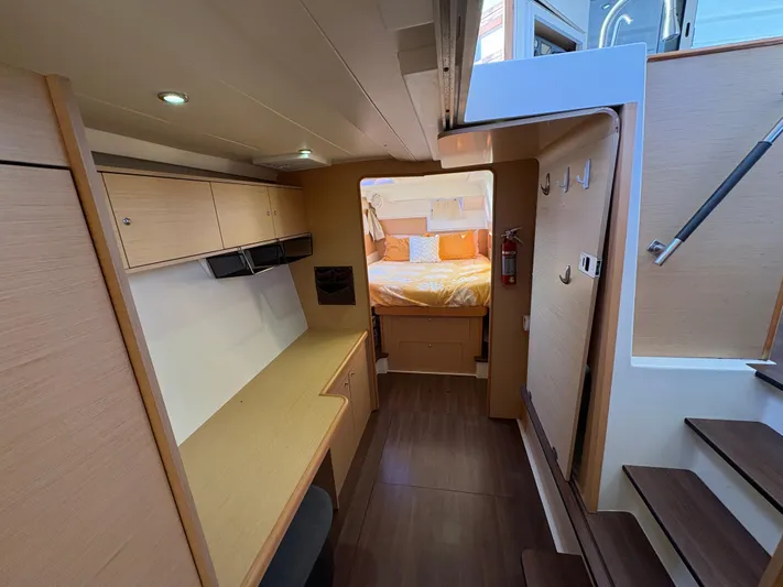 Chasing Summer Yacht Photos Pics Interior of 2012 Lagoon 400 yacht, featuring a cozy cabin and modern wooden furnishings.