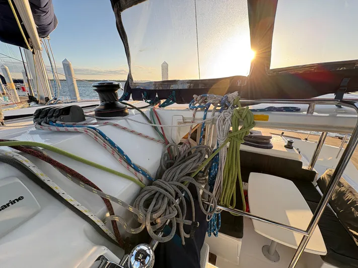 Chasing Summer Yacht Photos Pics Lagoon 400 sailboat cockpit with ropes, sunset view, 2012 model.