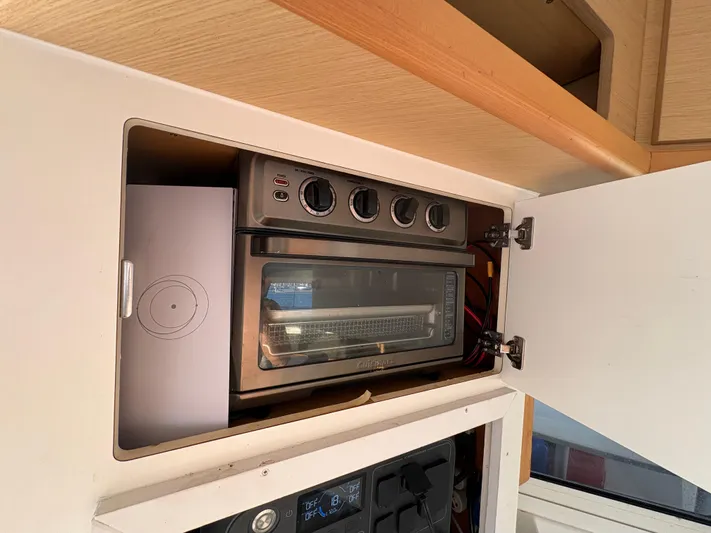 Chasing Summer Yacht Photos Pics Built-in toaster oven in 2012 Lagoon 400 yacht kitchen cabinet.