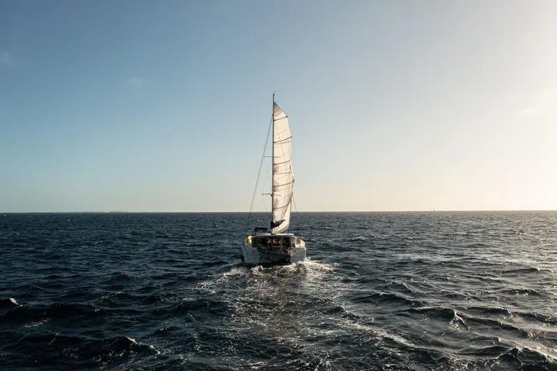 Chasing Summer Yacht Photos Pics Sailing Lagoon 400 catamaran on open sea, 2012 model, under clear sky.