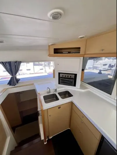 Chasing Summer Yacht Photos Pics Interior of 2012 Lagoon 400 catamaran kitchen with modern appliances and ample counter space.