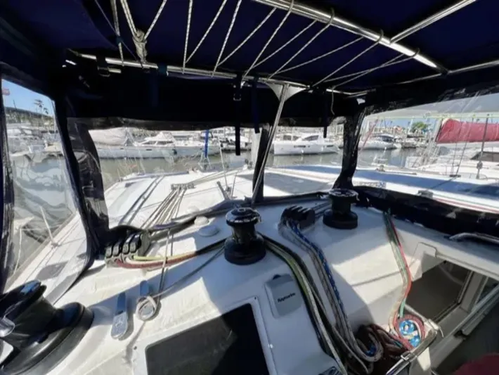 Chasing Summer Yacht Photos Pics Cockpit view of 2012 Lagoon 400 catamaran with ropes and winches in a marina.