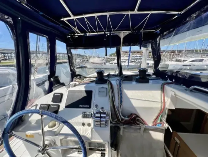 Chasing Summer Yacht Photos Pics Interior view of a 2012 Lagoon 400 catamaran cockpit with navigation equipment.