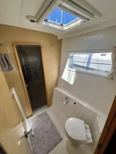 Chasing Summer Yacht Photos Pics 2012 Lagoon 400 yacht bathroom with skylight, shower, and toilet.