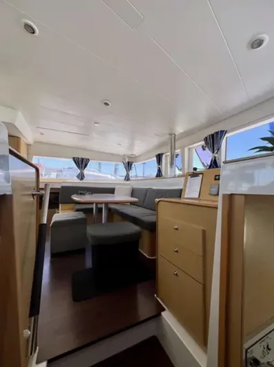 Chasing Summer Yacht Photos Pics Interior of 2012 Lagoon 400 catamaran with modern seating and dining area.