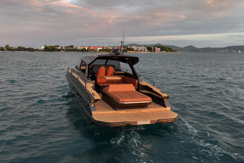  Yacht Photos Pics Luxury Focus 3X 2025 yacht cruising on serene waters at sunset.