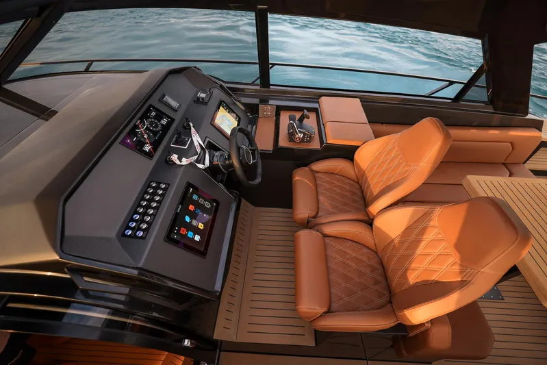  Yacht Photos Pics Luxurious 2025 Focus 3X yacht cockpit with leather seats and advanced navigation controls.