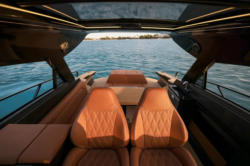  Yacht Photos Pics Luxurious interior of 2025 Focus 3X yacht with leather seating and panoramic water view.