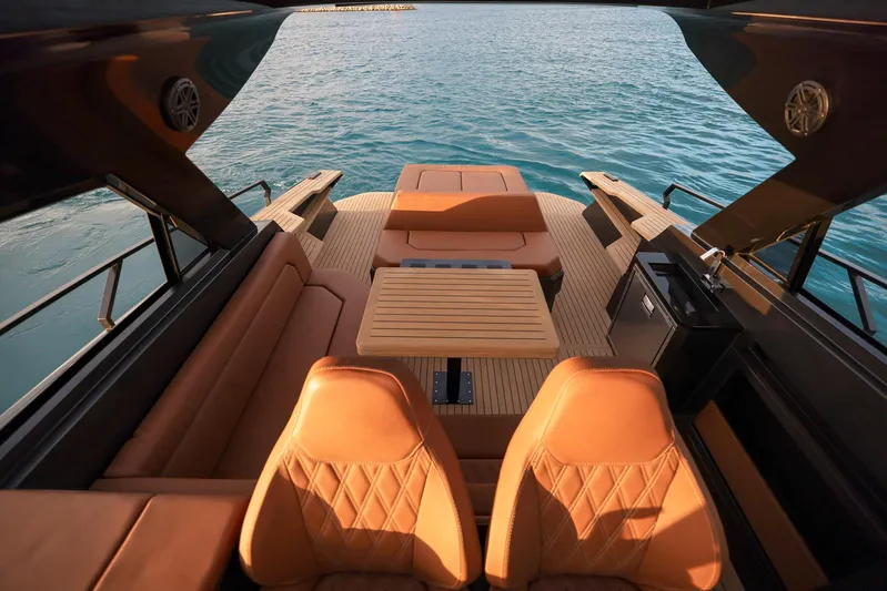  Yacht Photos Pics Luxurious interior of 2025 Focus 3X yacht with leather seating and wooden table.