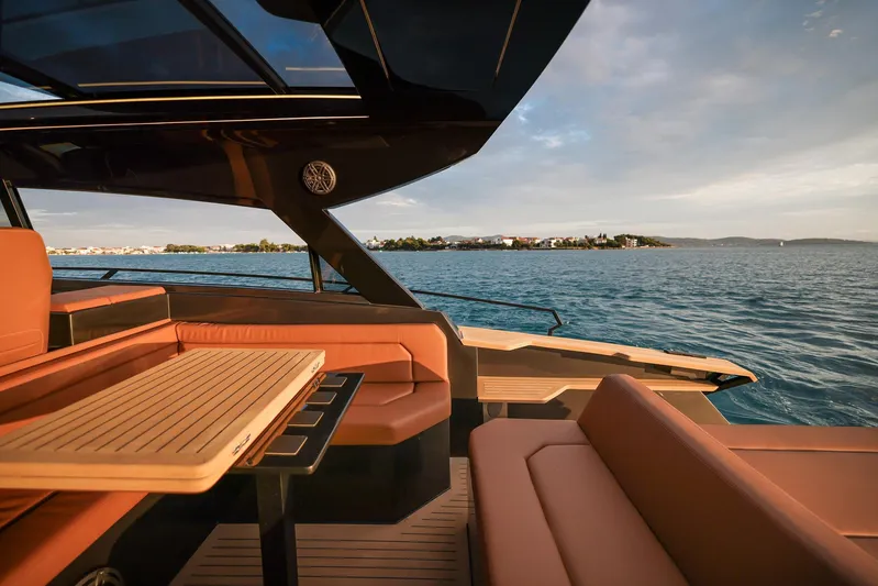  Yacht Photos Pics Luxurious 2025 Focus 3X yacht interior with elegant seating and ocean view.