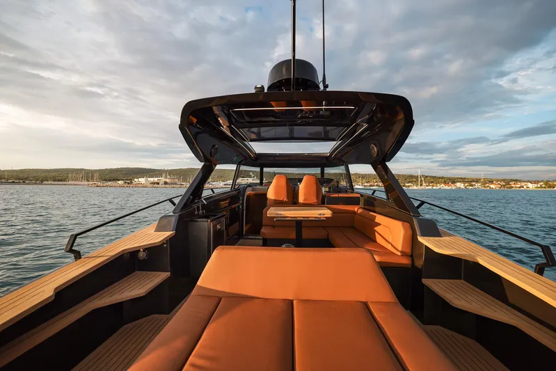  Yacht Photos Pics Luxurious 2025 Focus 3X yacht interior with elegant seating and scenic ocean view.