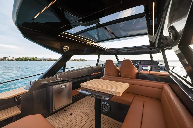  Yacht Photos Pics Luxurious 2025 Focus 3X yacht interior with leather seating and panoramic views.