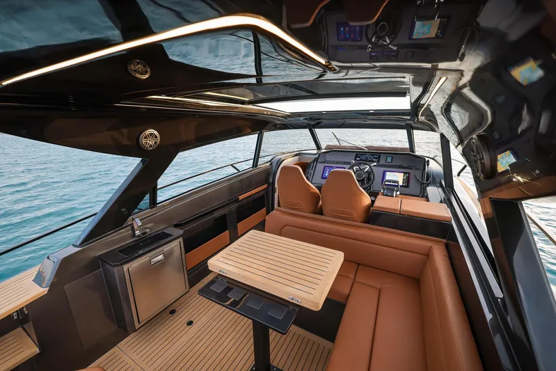  Yacht Photos Pics Luxurious interior of 2025 Focus 3X yacht with leather seating and modern navigation equipment.