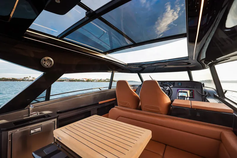  Yacht Photos Pics Luxurious interior of 2025 Focus 3X yacht with panoramic windows and modern seating.
