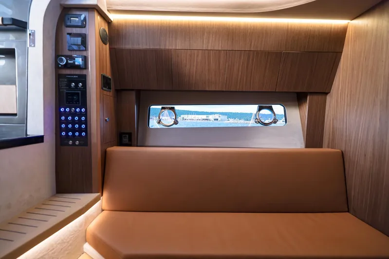  Yacht Photos Pics Luxurious interior of 2025 Focus 3X yacht with wood paneling and leather seating.