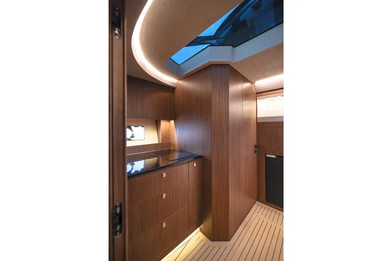  Yacht Photos Pics Luxurious interior of 2025 Focus 3X yacht with sleek wood finish and modern lighting.