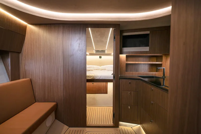  Yacht Photos Pics Luxurious interior of 2025 Focus 3X yacht with wood finish and modern lighting.