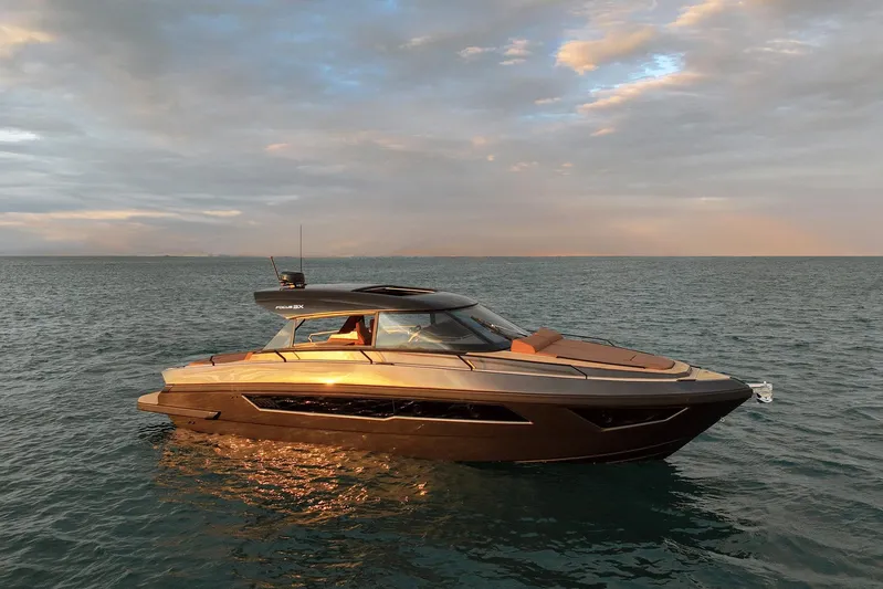 Yacht Photos Pics Luxurious 2025 Focus 3X yacht on tranquil ocean at sunset.