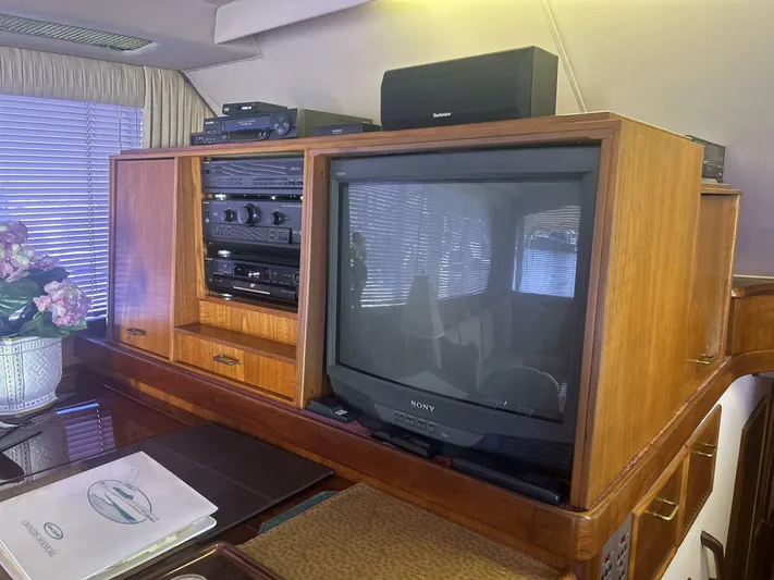 Seclusion Yacht Photos Pics Interior of 1988 Ocean Yachts 55 Super Sport with vintage TV and audio system.