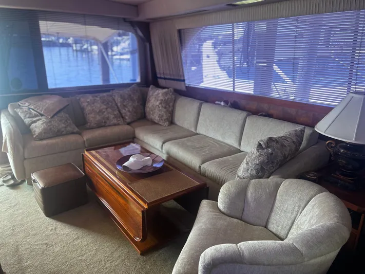 Seclusion Yacht Photos Pics Luxurious interior of a 1988 Ocean Yachts 55 Super Sport with plush seating and elegant decor.