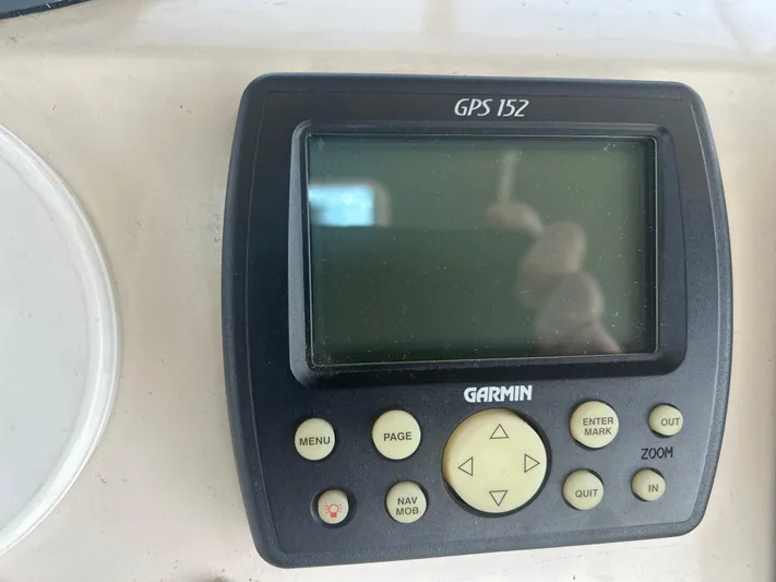 Seclusion Yacht Photos Pics Garmin GPS 152 device on 1988 Ocean Yachts 55 Super Sport boat dashboard.