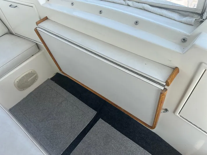 Seclusion Yacht Photos Pics Interior of 1988 Ocean Yachts 55 Super Sport with seating and storage.