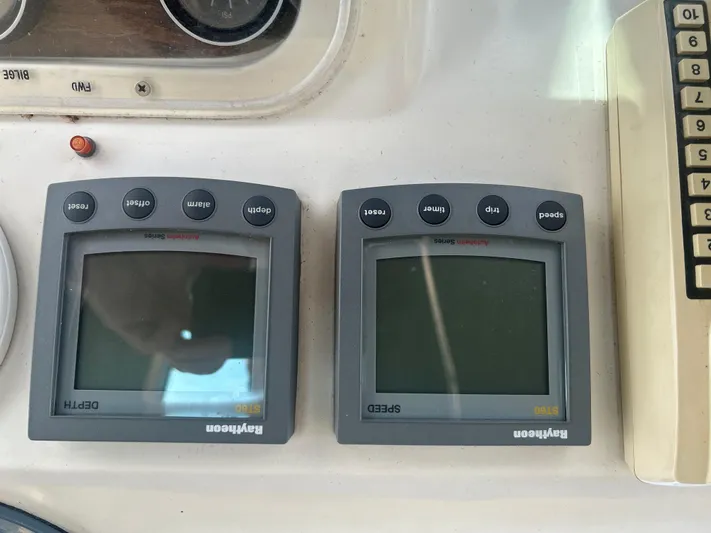 Seclusion Yacht Photos Pics Control panel of a 1988 Ocean Yachts 55 Super Sport with Raytheon ST60 displays.
