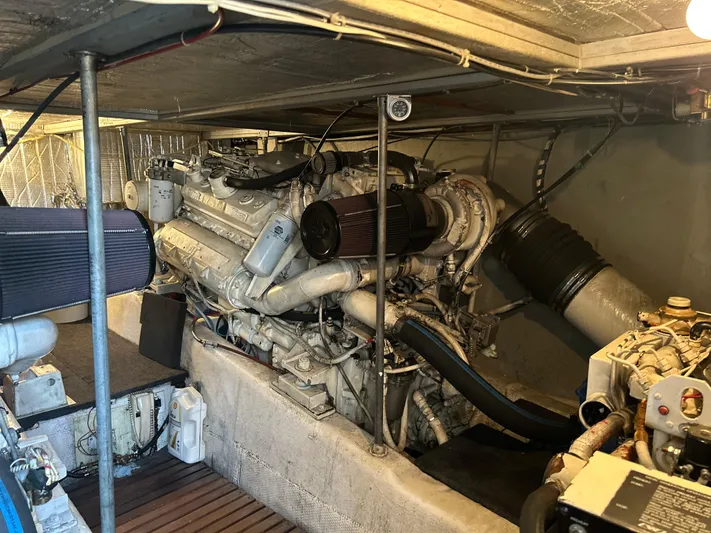 Seclusion Yacht Photos Pics Engine room of 1988 Ocean Yachts 55 Super Sport, showcasing powerful marine engine components.