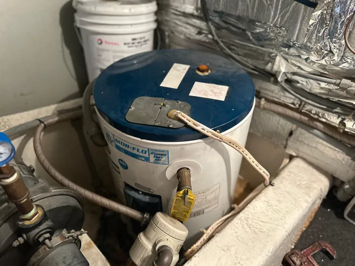 Seclusion Yacht Photos Pics Water heater in the engine room of a 1988 Ocean Yachts 55 Super Sport.