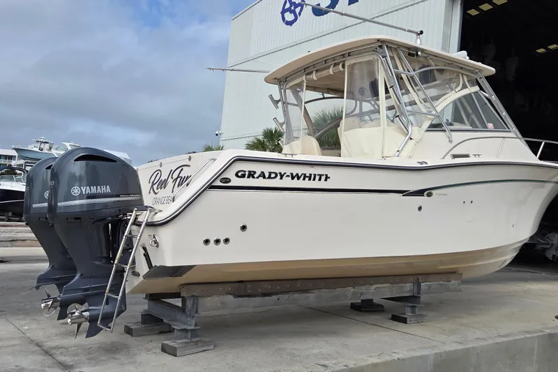 Reel Fun Yacht Photos Pics 2013 Grady-White Express 330 boat with Yamaha engines on a dock.