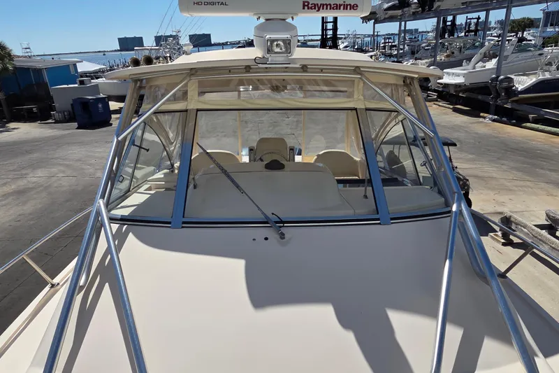 Reel Fun Yacht Photos Pics 2013 Grady-White Express 330 boat docked, featuring Raymarine equipment and spacious cockpit.